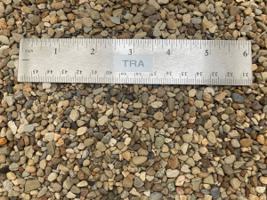 as1 antiskid gravel at our supply yard next to a ruler to show size