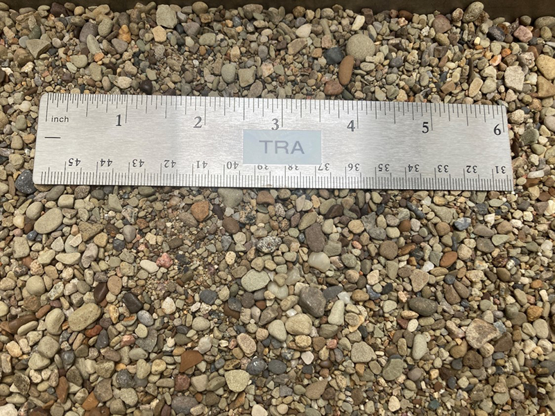 as1 antiskid gravel shown next to ruler for size