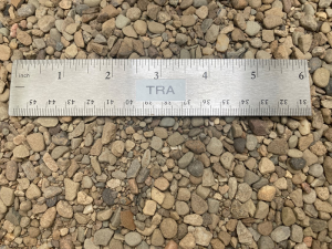 as2 antiskid gravel at our supply yard next to a ruler to show size