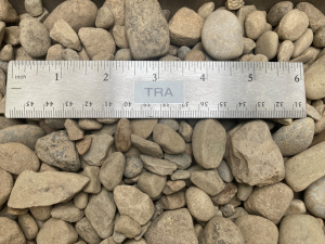 number 57 gravel at our aggregate supply yard next to a ruler to show size