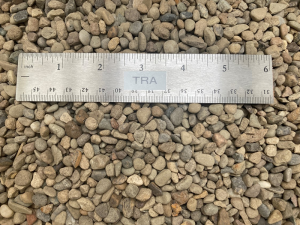 number 8 gravel at our supply yard next to a ruler to show size