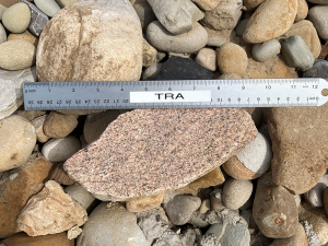 oversized gravel next to a ruler to show size