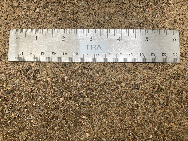 type c regular mason sand at our supply yard next to a ruler to show size